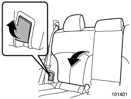 Unlock the seatback by pulling the release lever and then fold the seatback down.