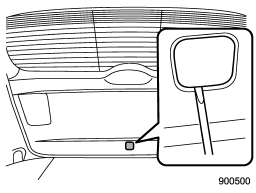 1. Remove the access cover at the bottom-center of the rear gate trim using flat-head