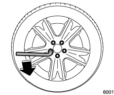 7. Loosen the wheel nuts using the wheel nut wrench but do not remove the nuts.