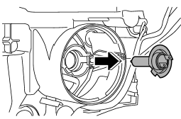 5. Replace the bulb, then set the retainer spring securely.